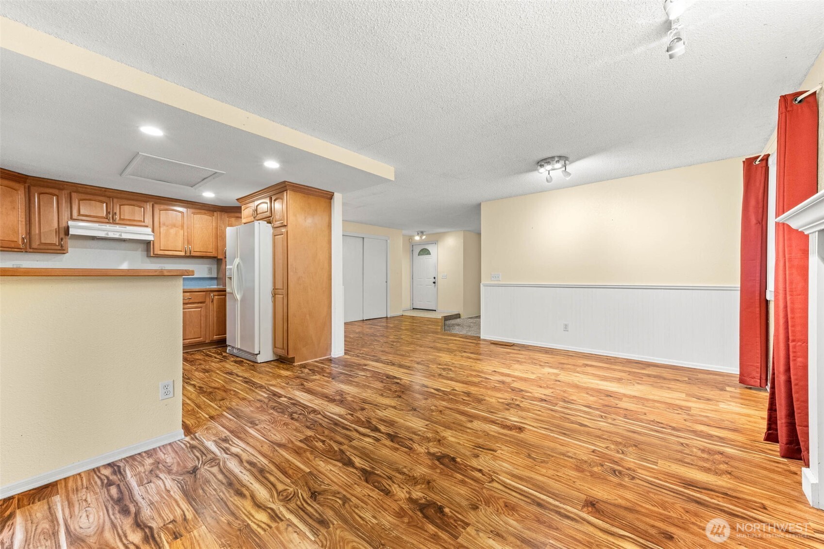 8529 37th Court Southeast Lacey, WA 98503 - Photo 8 of 34 a view of a kitchen with a refrigerator and a window