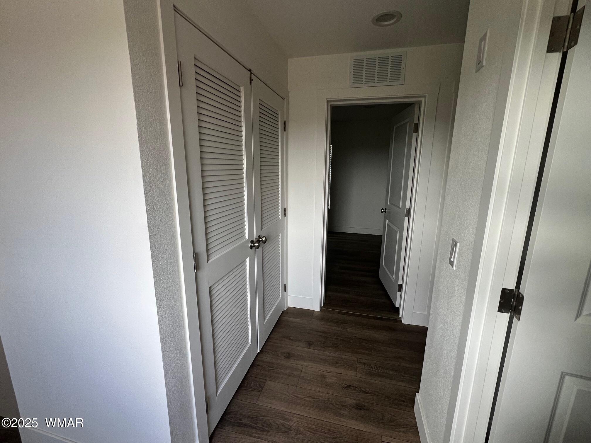4129 Apache Road Snowflake, AZ 85937 - Photo 15 of 48 a view of a hallway with wooden floor and staircase