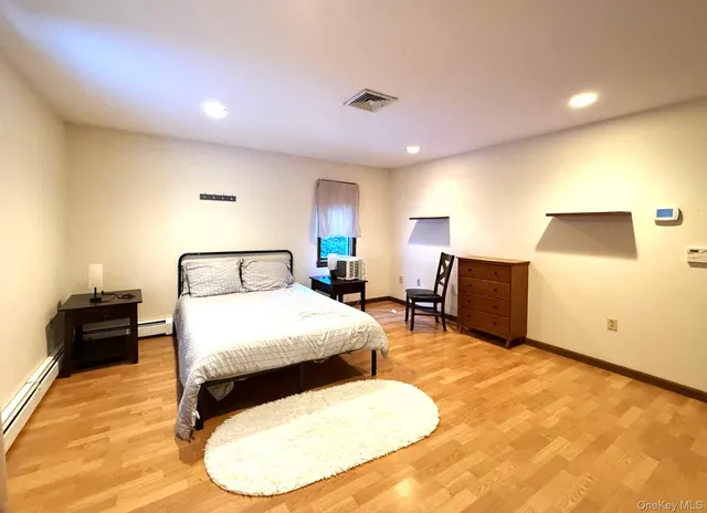 a bed room with a bed and furniture