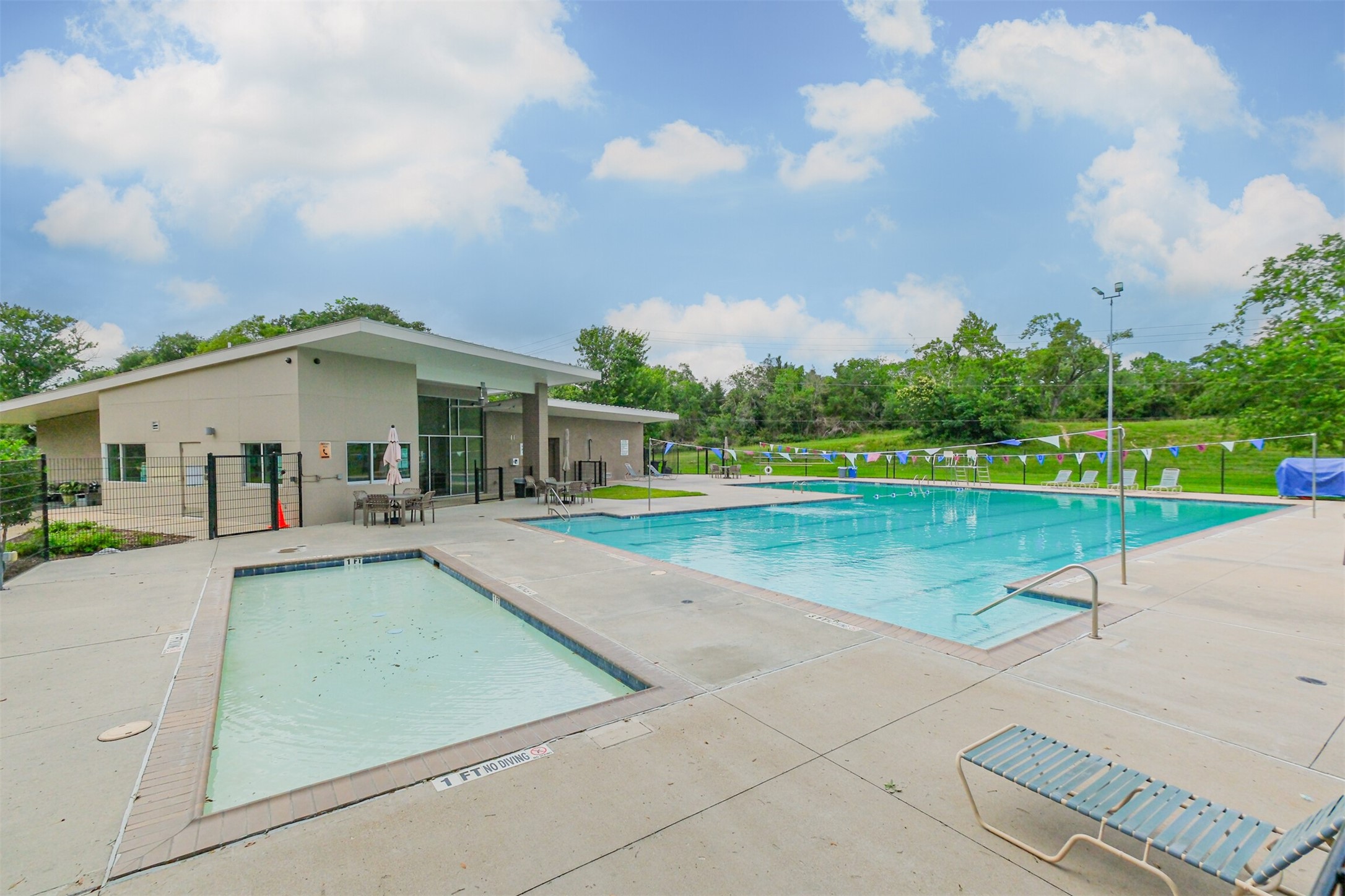 1007 Arrow Hill Road Houston, TX 77077 - Photo 42 of 50 a view of a house with a swimming pool and a yard
