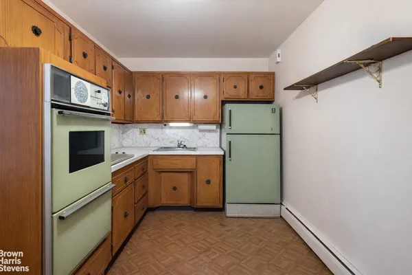 a kitchen with a sink appliances and cabinets