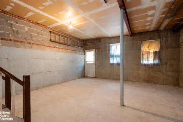 a bathroom with a granite countertop toilet sink and mirror