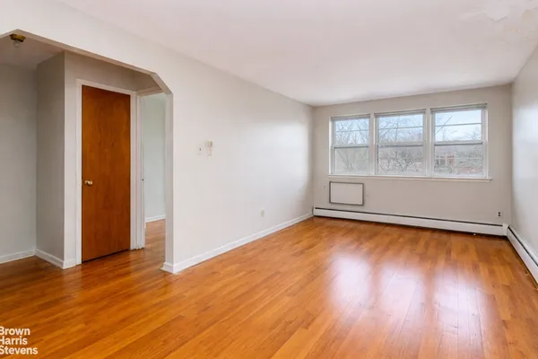 a view of a livingroom with wooden floor