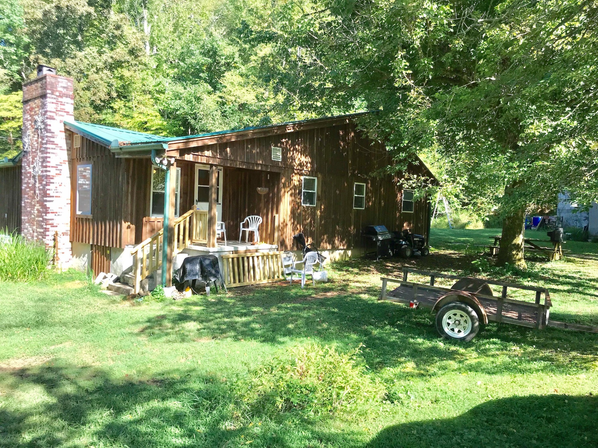1526 Blockhouse Road Maryville, TN 37803 - Photo 2 of 2 a view of a backyard with table and chairs and a large tree