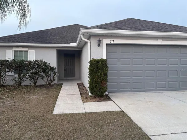 a front view of house with yard