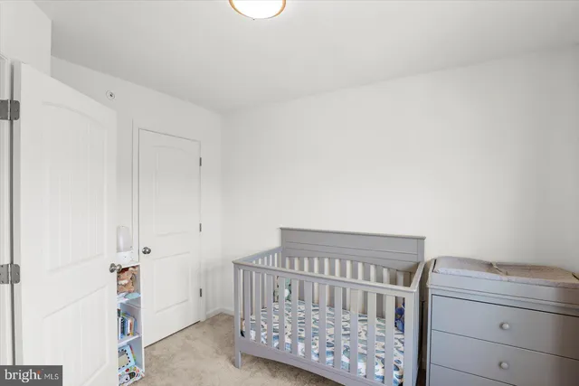 a room with a chair and a window