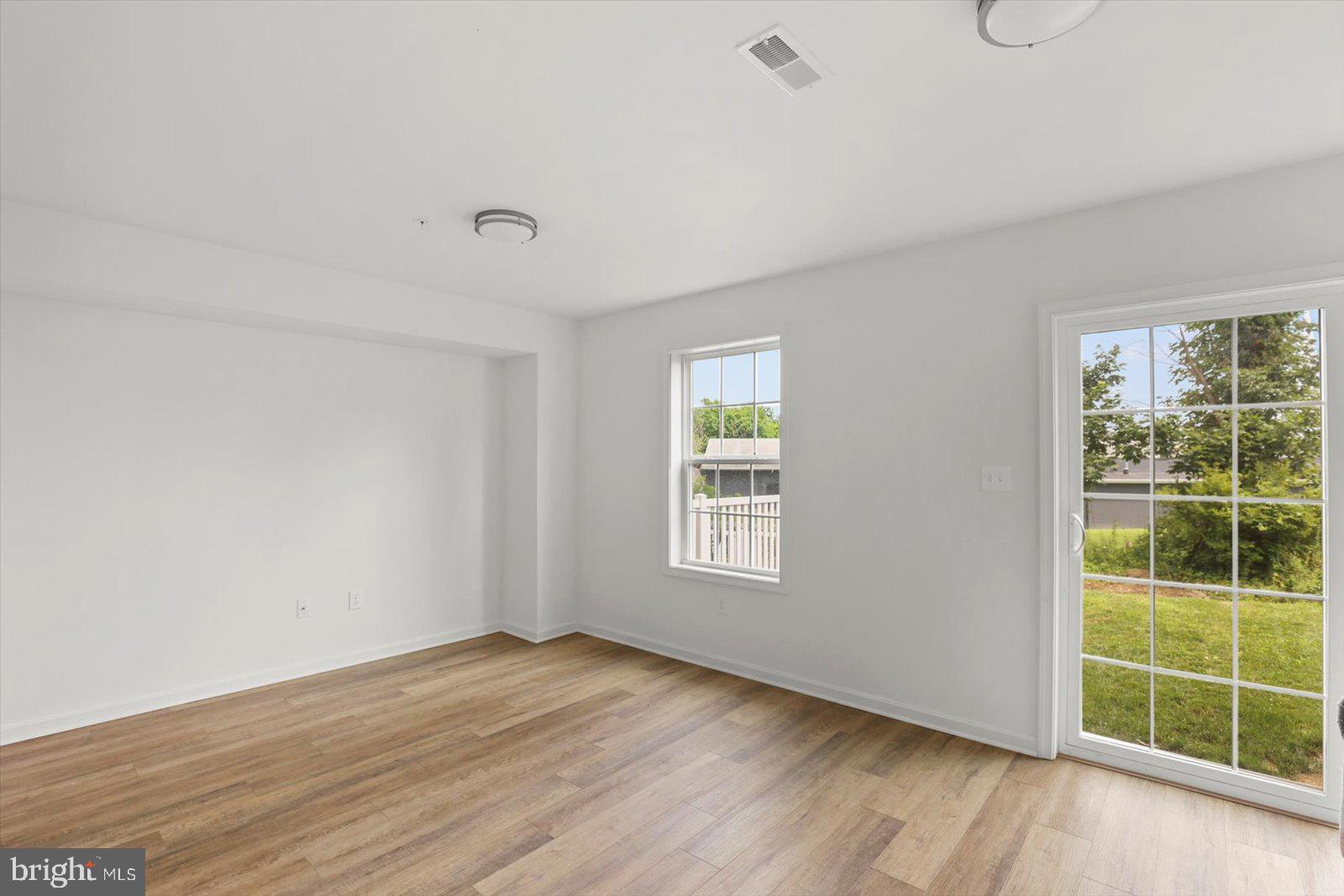 103 Overlook Dr. Hanover, PA 17331 - Photo 31 of 39 an empty room with wooden floor and windows