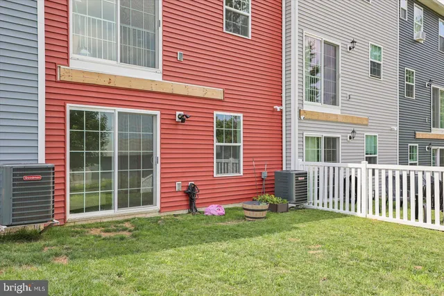 a view of a house with a chairs in a patio