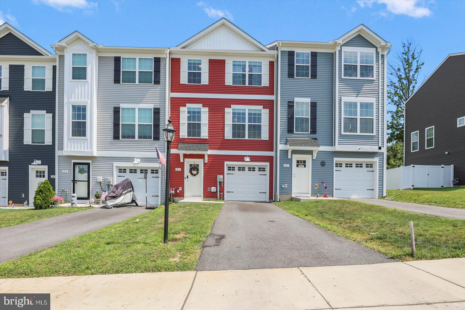 103 Overlook Dr. Hanover, PA 17331 - Photo 4 of 39 a front view of a residential apartment building with a yard