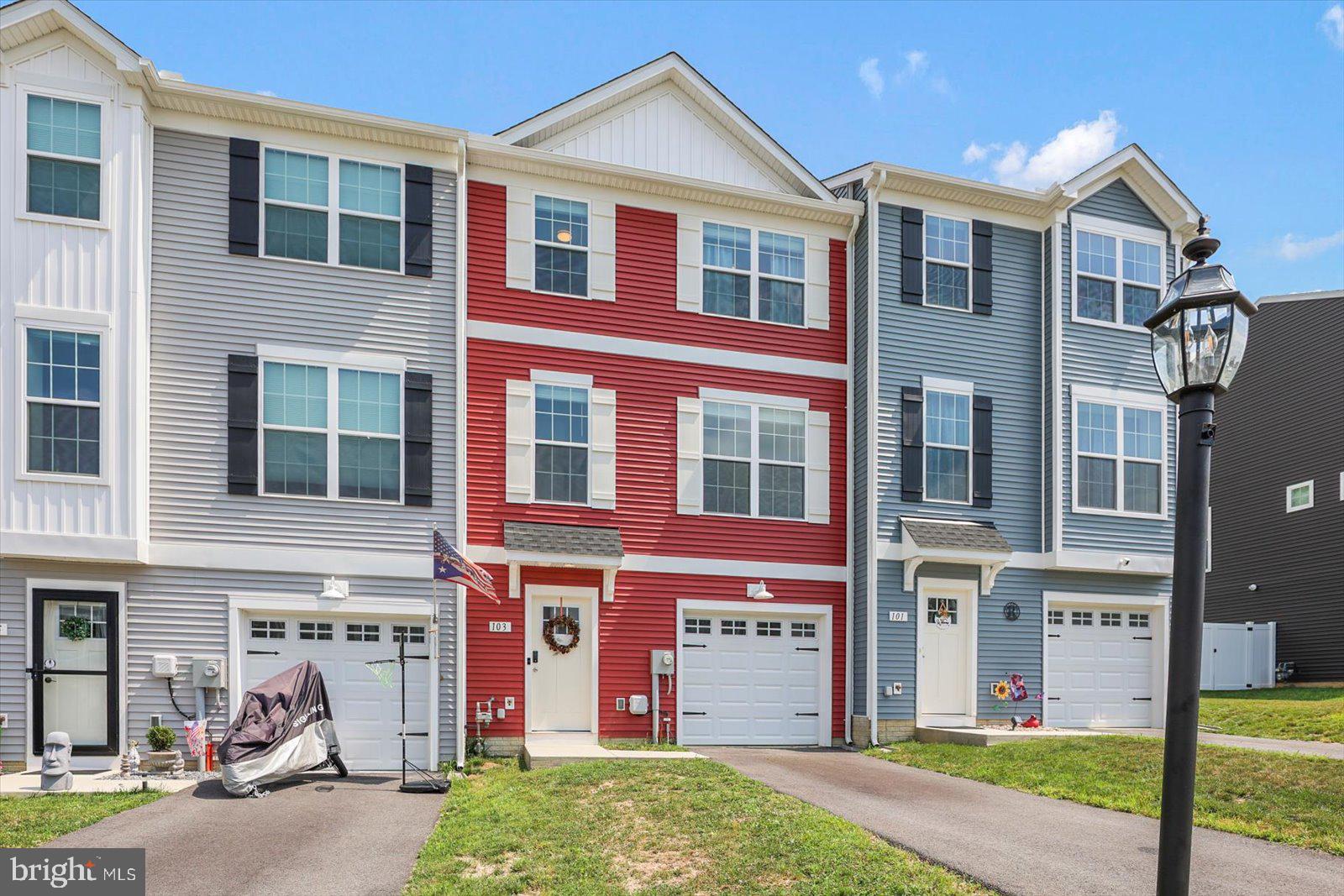 103 Overlook Dr. Hanover, PA 17331 - Photo 5 of 39 a front view of a house with a yard and garage