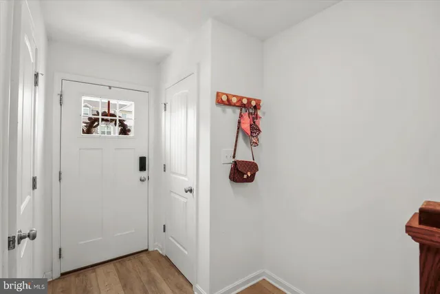 a kitchen with a sink a refrigerator a microwave and cabinets
