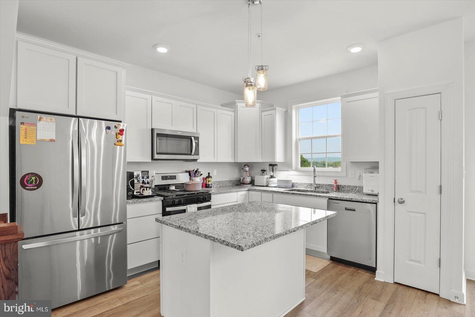 103 Overlook Dr. Hanover, PA 17331 - Photo 10 of 39 a kitchen with a sink a refrigerator a microwave and cabinets