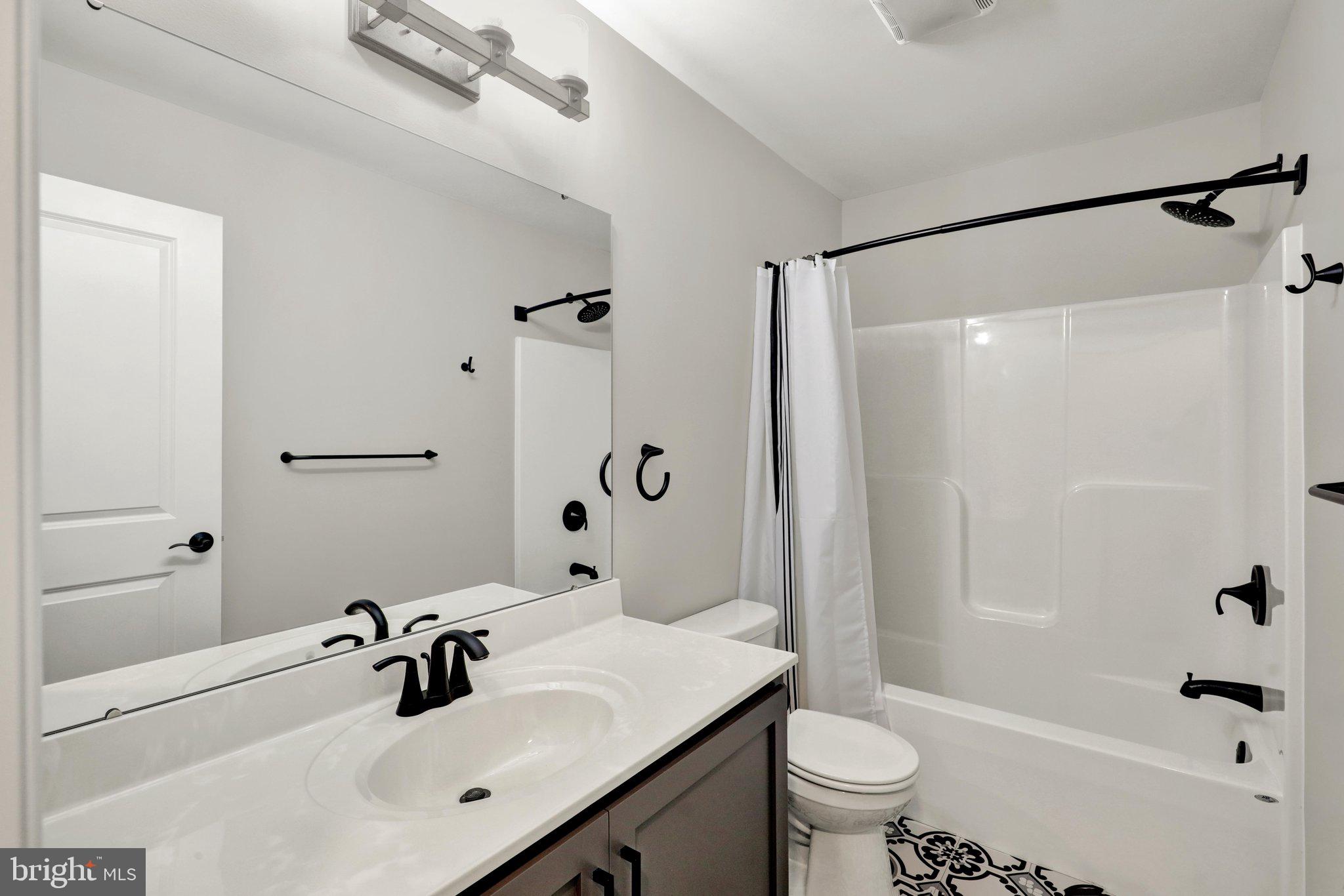 64 Middletown Road Fleetwood, PA 19522 - Photo 30 of 54 a bathroom with a sink toilet and shower