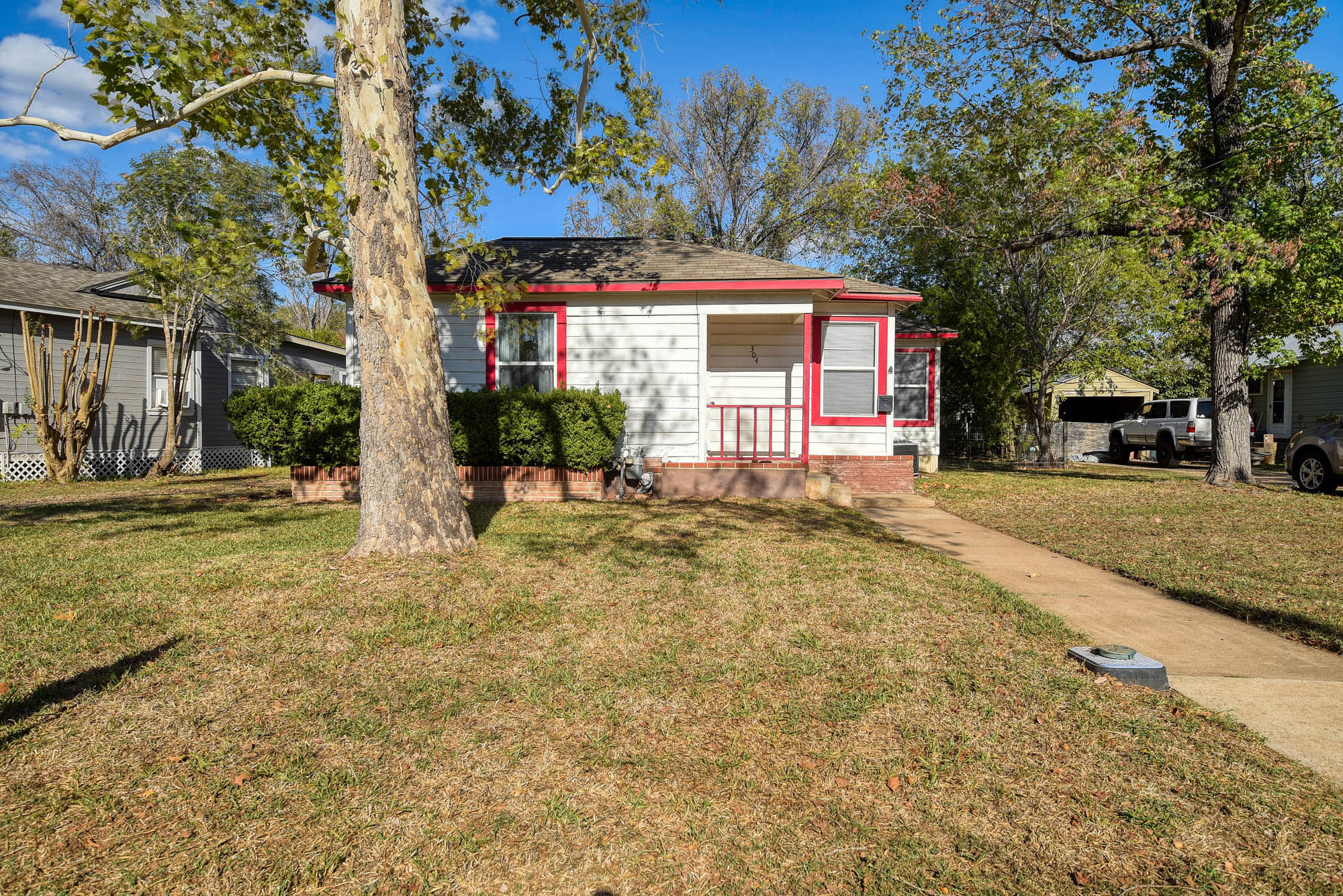 304 Cedar Street Bastrop, TX 78602 - Photo 2 of 33 a front view of a house with a yard