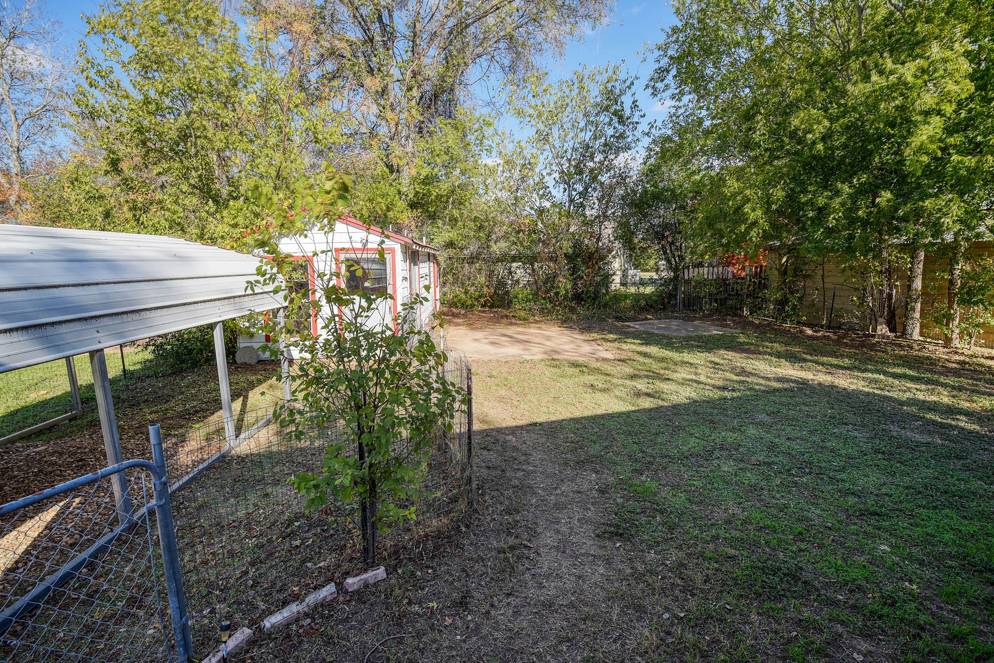 304 Cedar Street Bastrop, TX 78602 - Photo 28 of 33 a view of a yard with plants and trees
