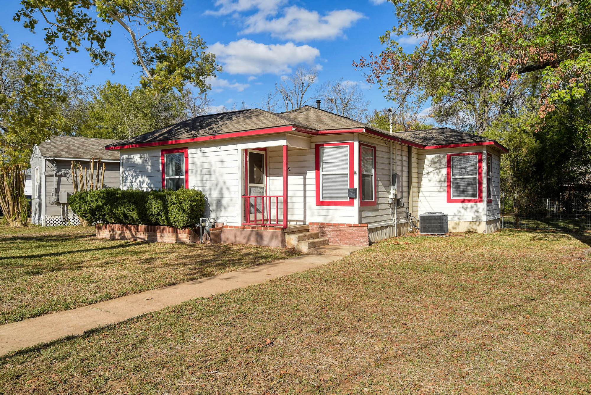 304 Cedar Street Bastrop, TX 78602 - Photo 4 of 33 a front view of a house with a yard