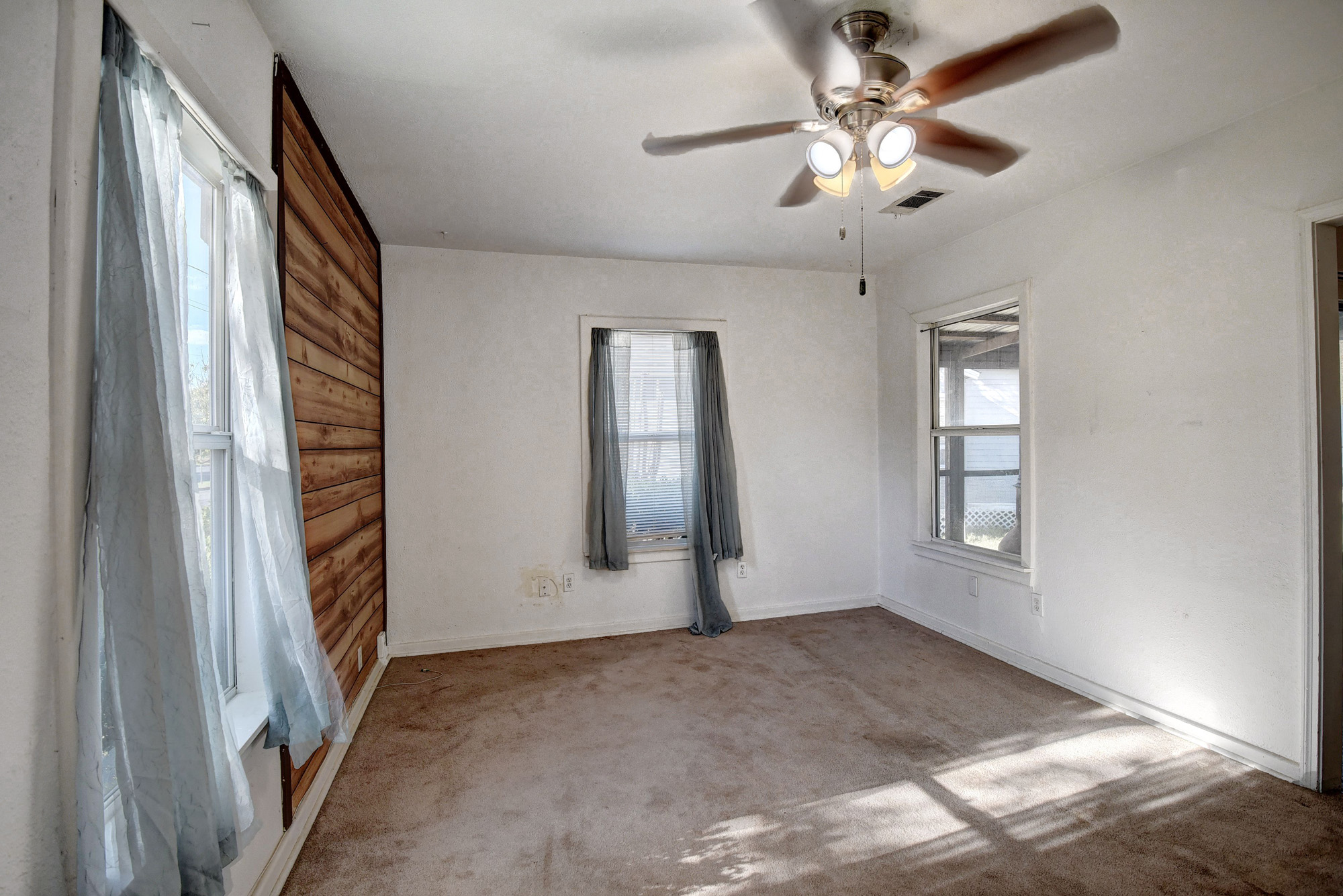 304 Cedar Street Bastrop, TX 78602 - Photo 9 of 33 wooden floor in an empty room with a window