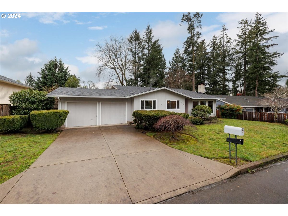 13400 Northwest Northrup Street Portland, OR 97229 - Photo 2 of 39 a front view of a house with garden