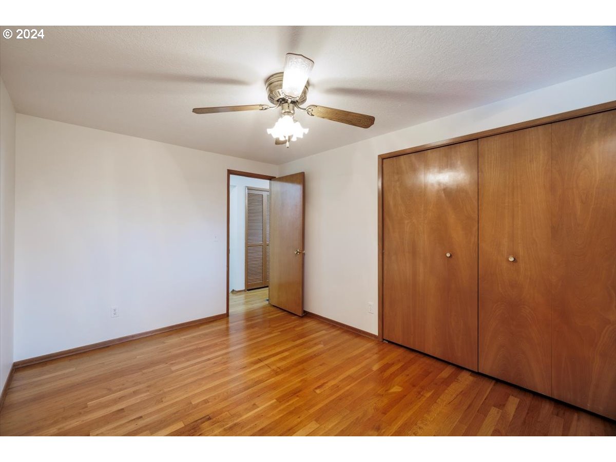 13400 Northwest Northrup Street Portland, OR 97229 - Photo 21 of 39 a view of an empty room with wooden floor