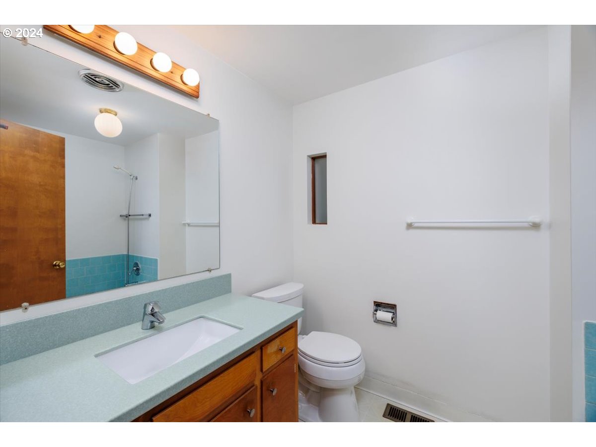 13400 Northwest Northrup Street Portland, OR 97229 - Photo 24 of 39 a bathroom with a granite countertop sink vanity mirror and toilet