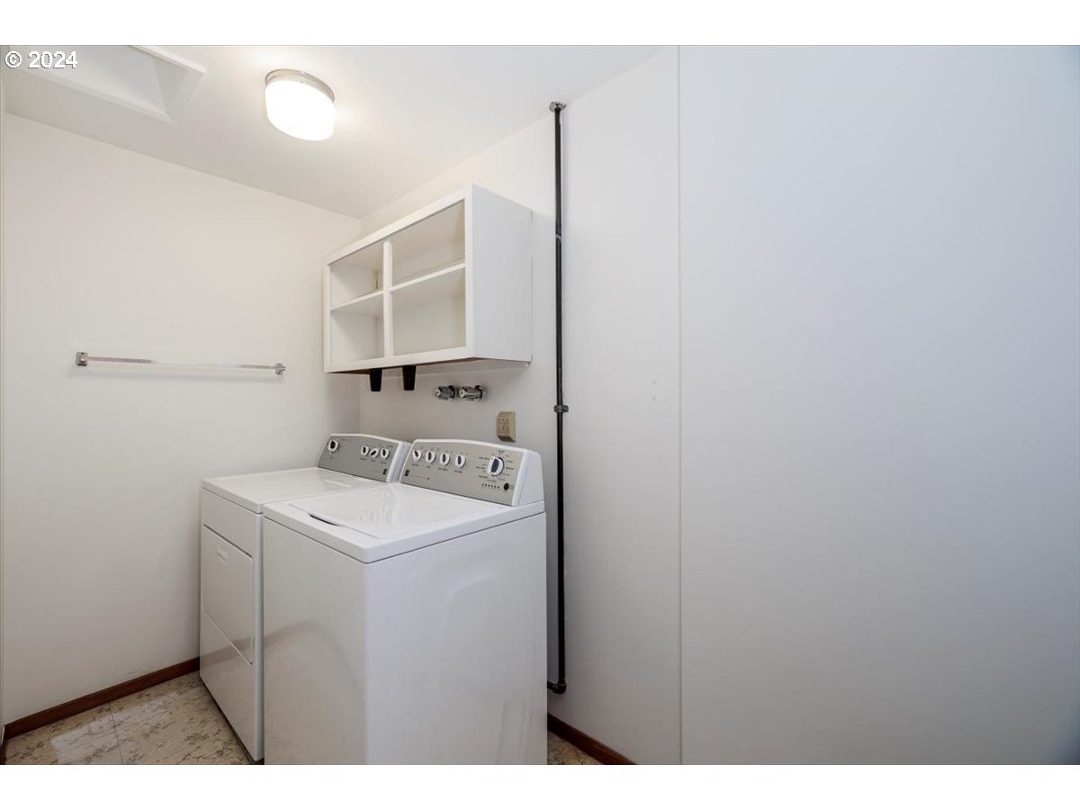 13400 Northwest Northrup Street Portland, OR 97229 - Photo 31 of 39 a utility room with dryer and washer