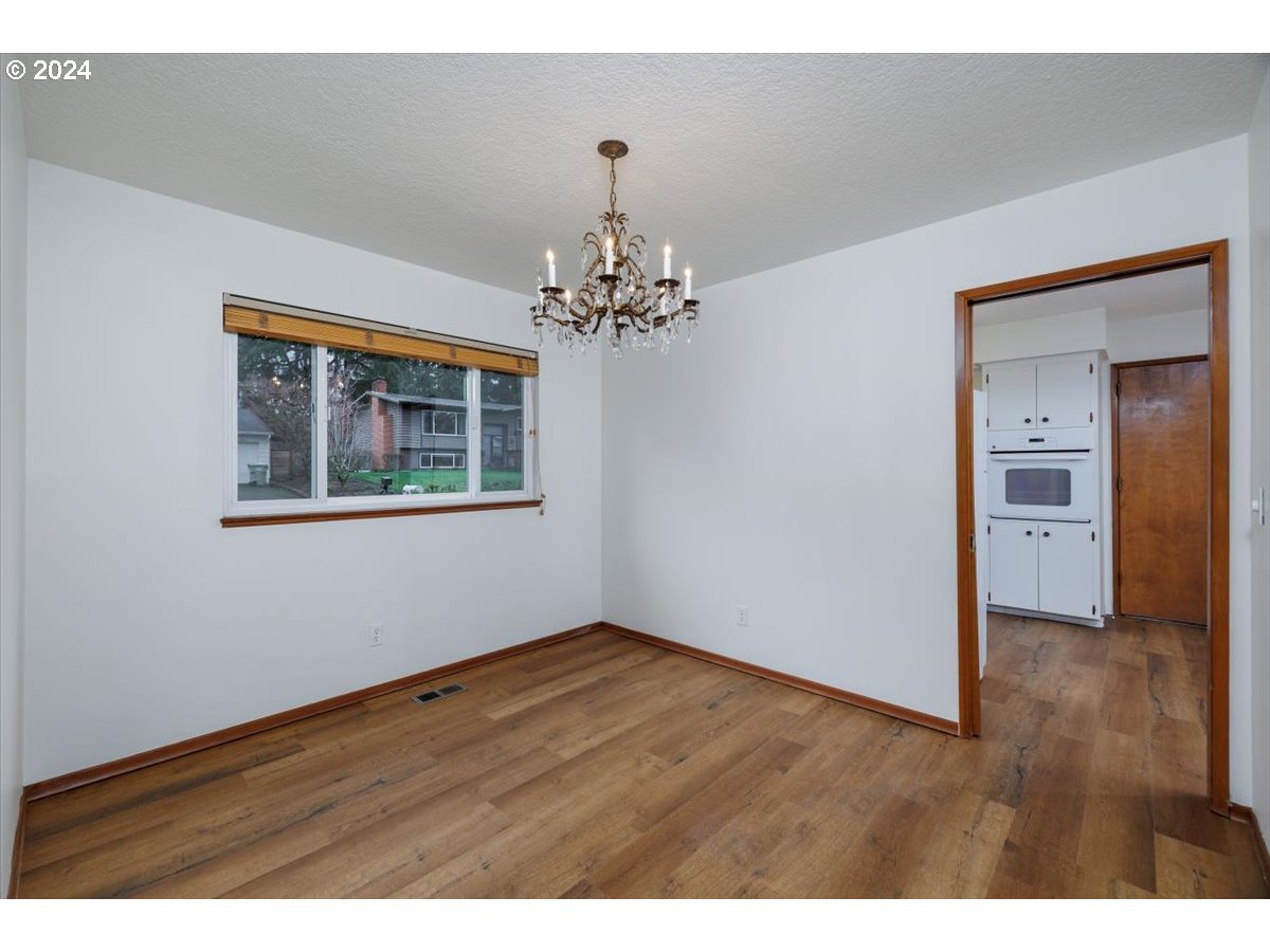 13400 Northwest Northrup Street Portland, OR 97229 - Photo 10 of 39 a view of a room with wooden floor and cabinet