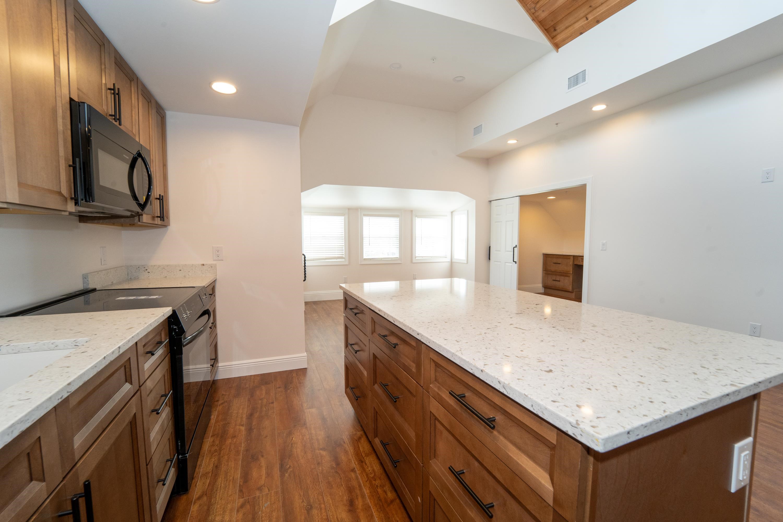 11 Aviles Street St. Augustine, FL 32084 - Photo 14 of 40 a kitchen with stainless steel appliances granite countertop a sink a stove and a wooden floors