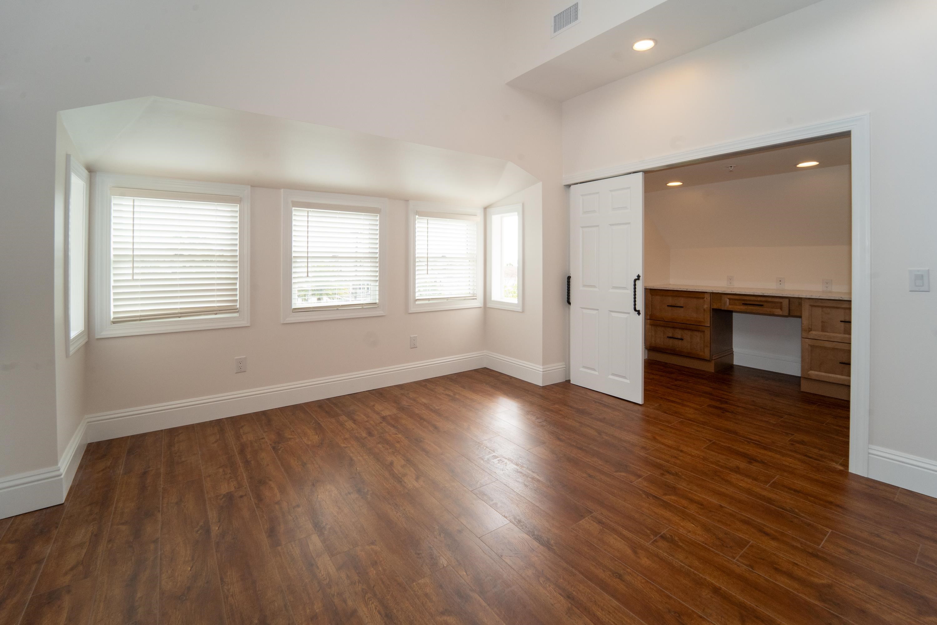 11 Aviles Street St. Augustine, FL 32084 - Photo 21 of 40 an empty room with wooden floor and windows