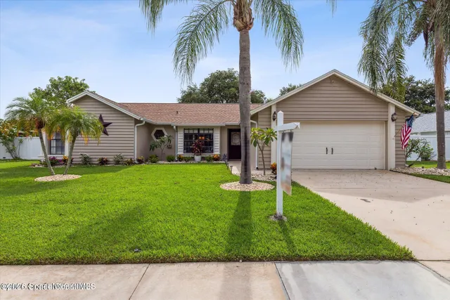 a house view with a garden space
