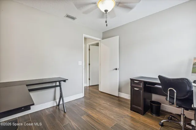 a view of workspace with wooden floor