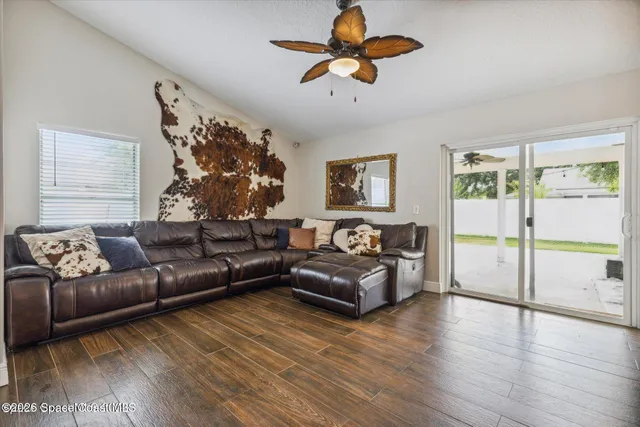 a living room with furniture and a large window