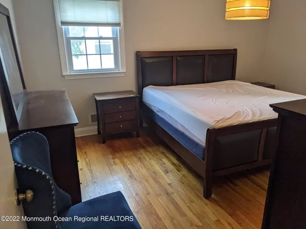 a bedroom with a bed and lamps