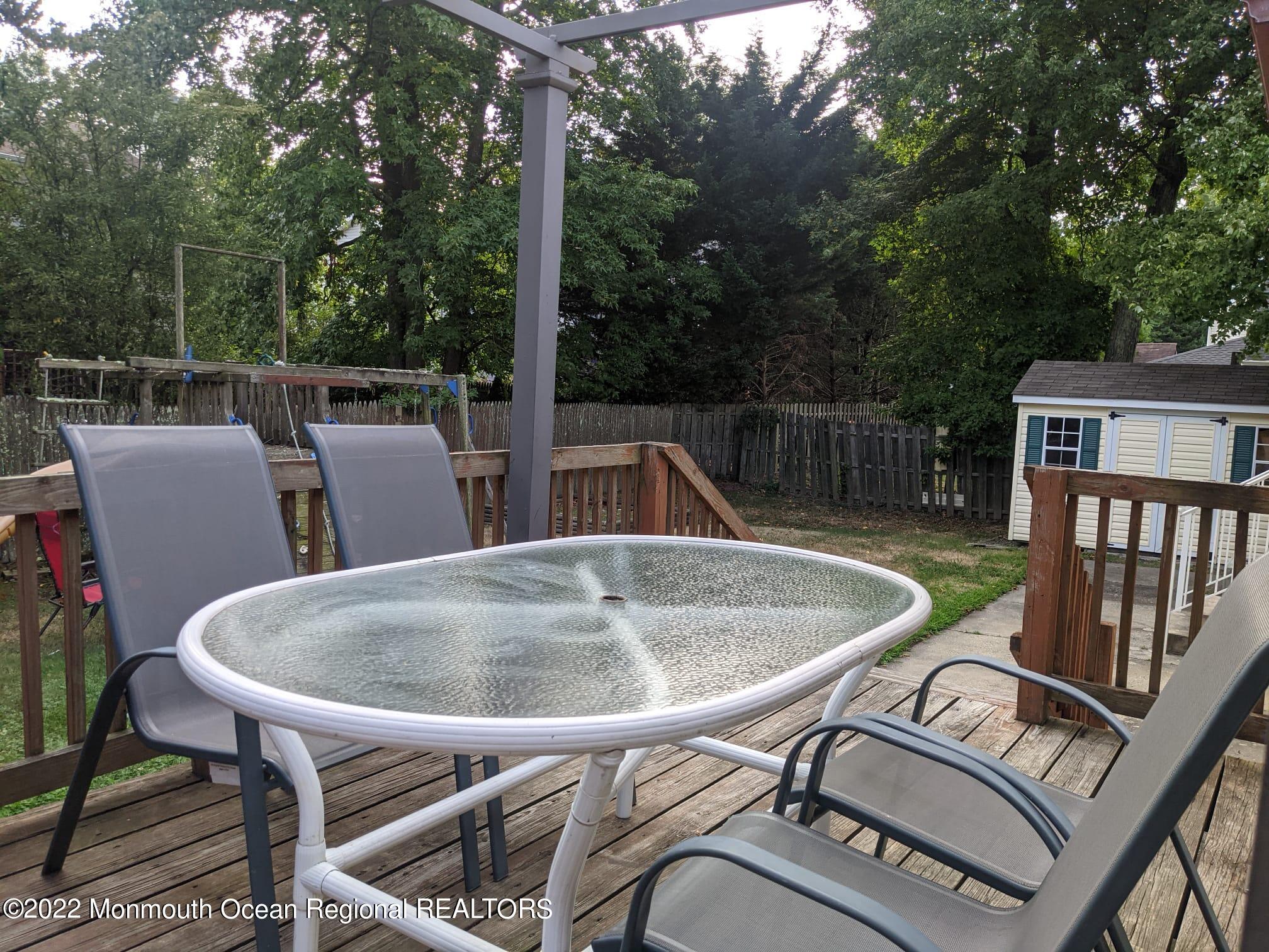 1304 Franklin Avenue Asbury Park, NJ 07712 - Photo 3 of 25 a balcony with table and chairs