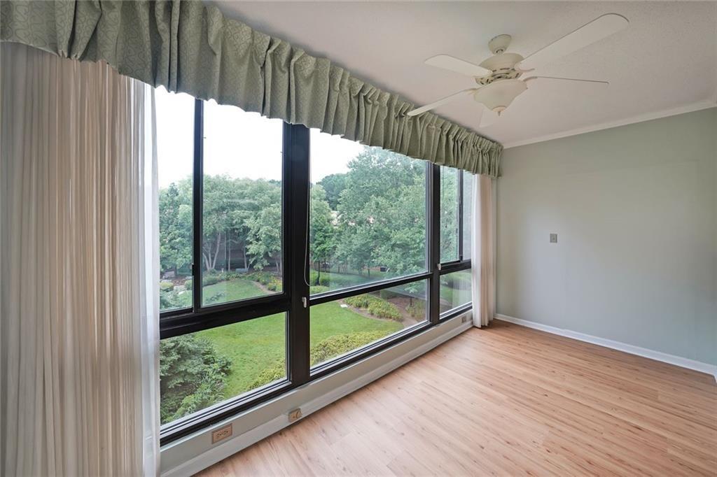 1800 Clairmont Lake, Unit A313 Decatur, GA 30033 - Photo 13 of 40 a view of a room with wooden floor chandelier and windows