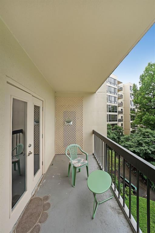 1800 Clairmont Lake, Unit A313 Decatur, GA 30033 - Photo 18 of 40 a view of a chair and table in a balcony