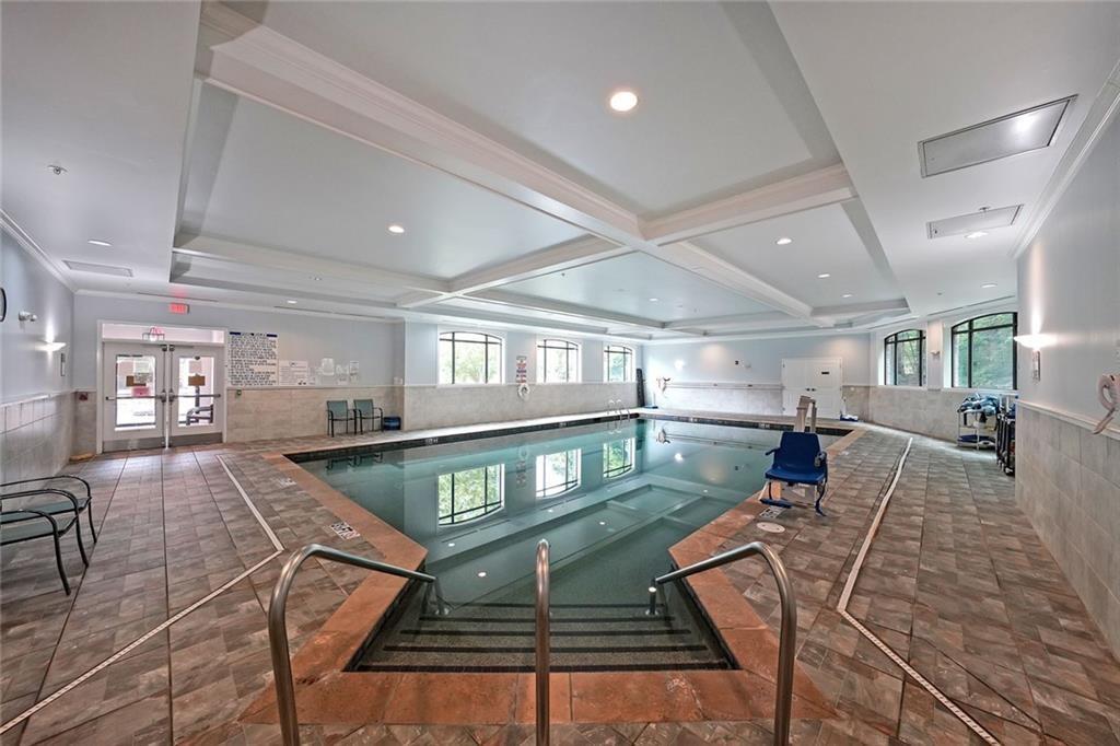 1800 Clairmont Lake, Unit A313 Decatur, GA 30033 - Photo 23 of 40 a living room with lots of furniture and a table