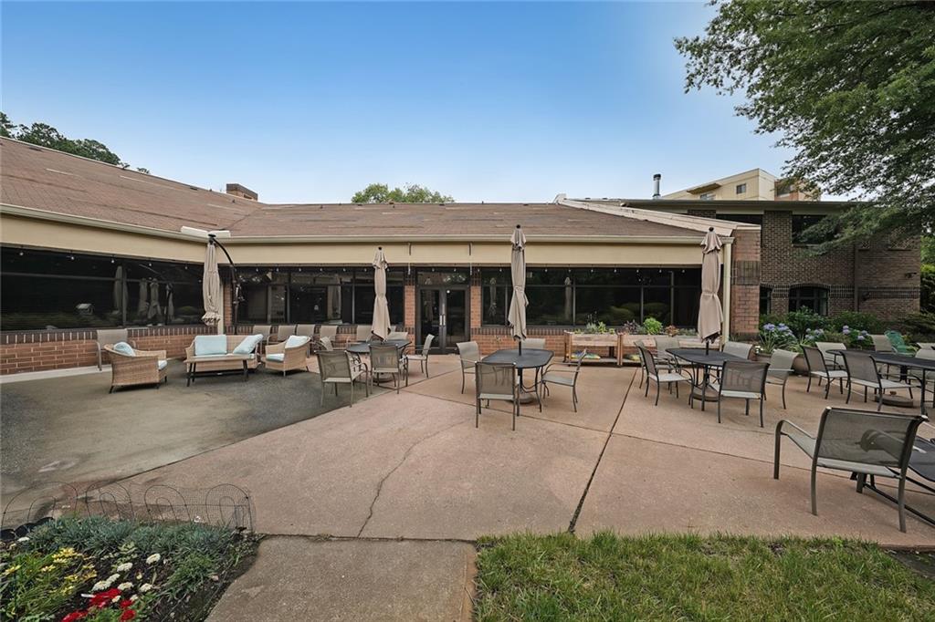 1800 Clairmont Lake, Unit A313 Decatur, GA 30033 - Photo 32 of 40 a view of the patio with table and chairs and potted plants