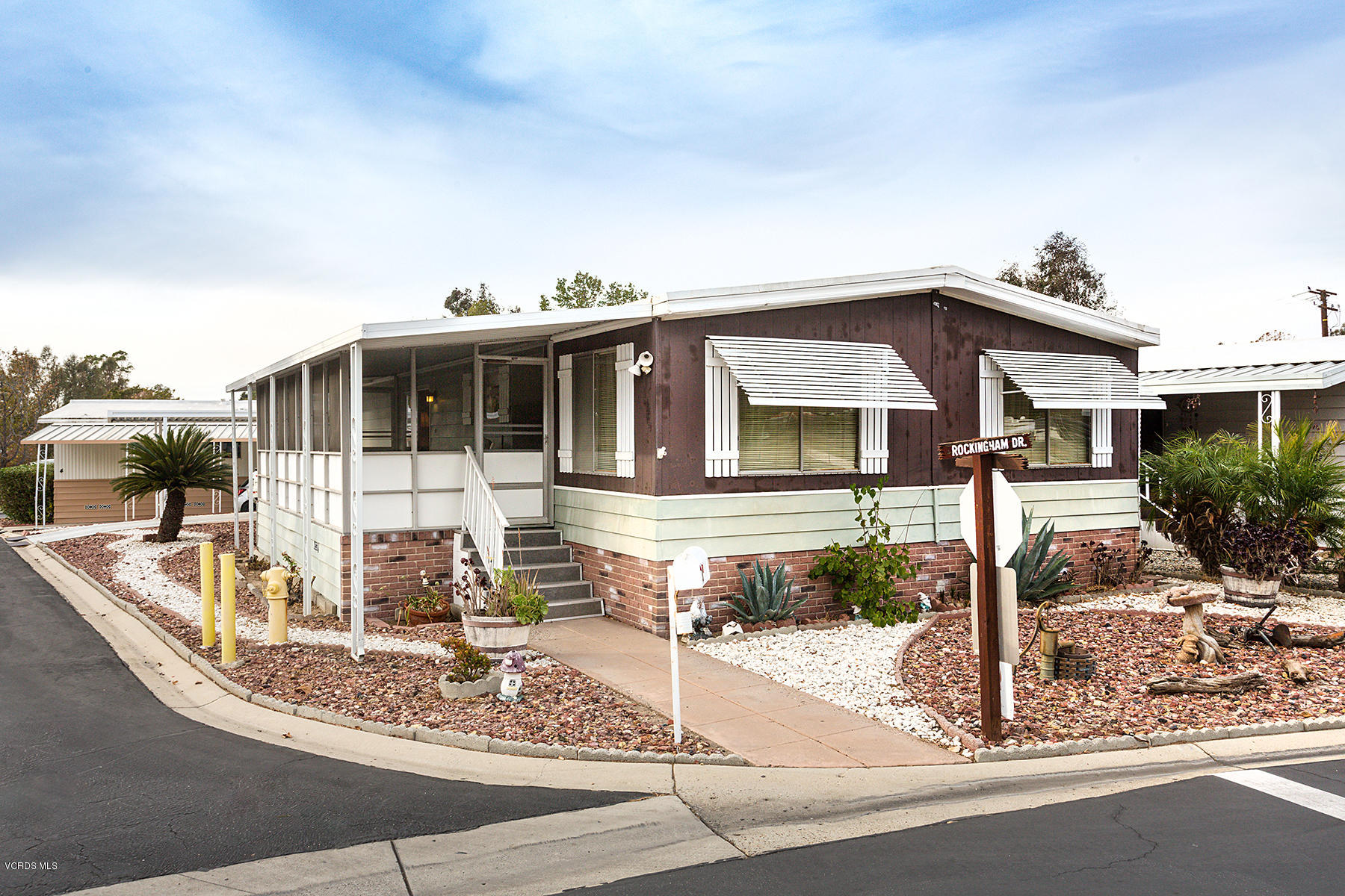 6480 Katherine Road, Unit 3 Simi Valley, CA 93063 - Photo 1 of 28 a front view of a house with street