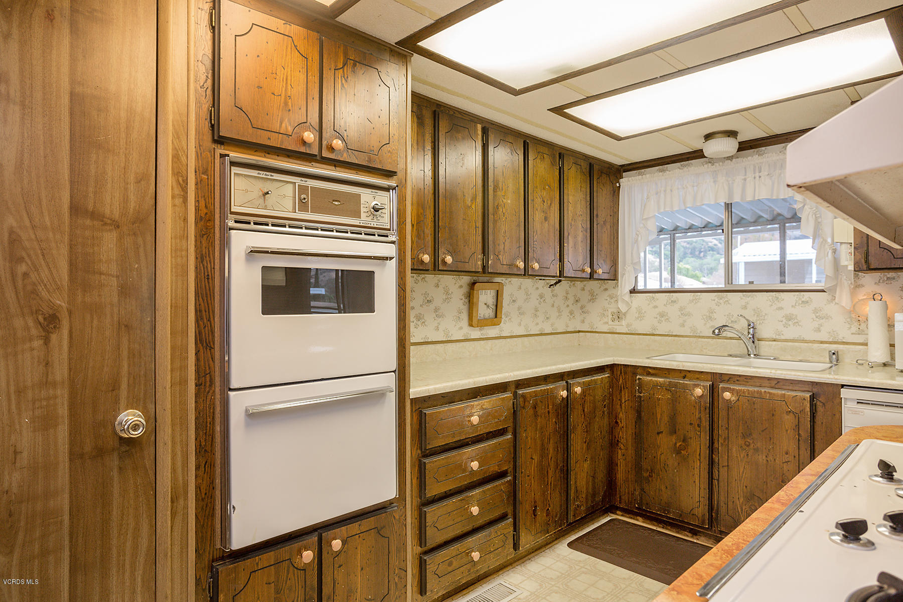6480 Katherine Road, Unit 3 Simi Valley, CA 93063 - Photo 12 of 28 a kitchen with stainless steel appliances granite countertop a refrigerator and a sink