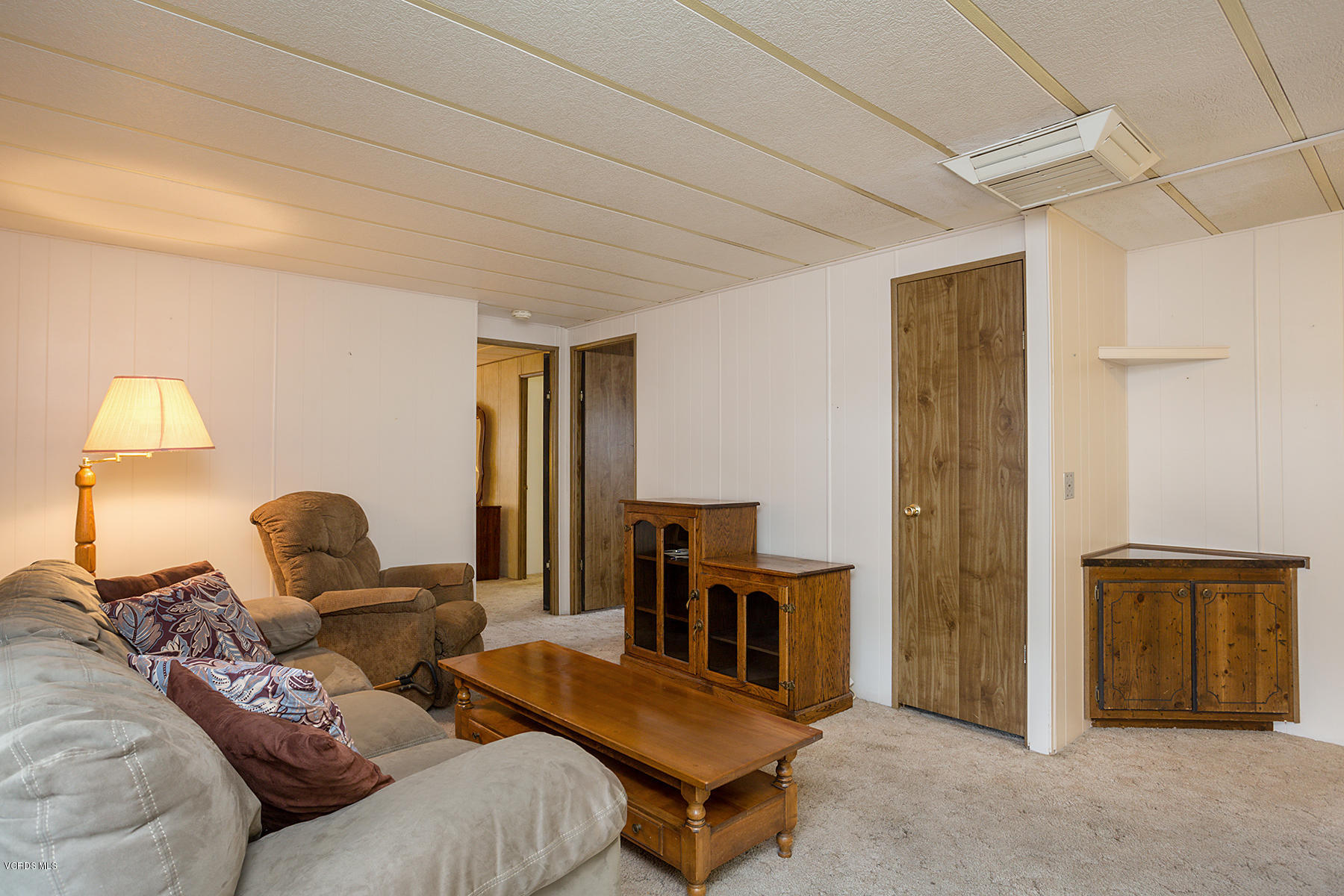 6480 Katherine Road, Unit 3 Simi Valley, CA 93063 - Photo 13 of 28 a living room with furniture and a lamp