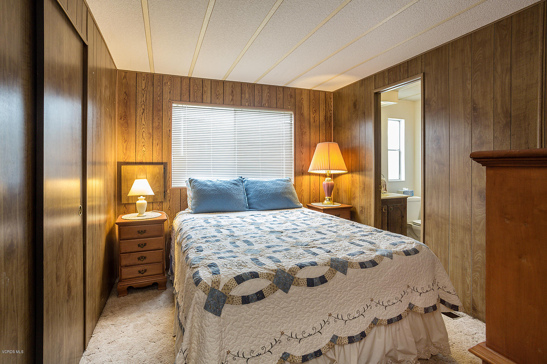 6480 Katherine Road, Unit 3 Simi Valley, CA 93063 - Photo 19 of 28 a bedroom with a bed and wooden floor