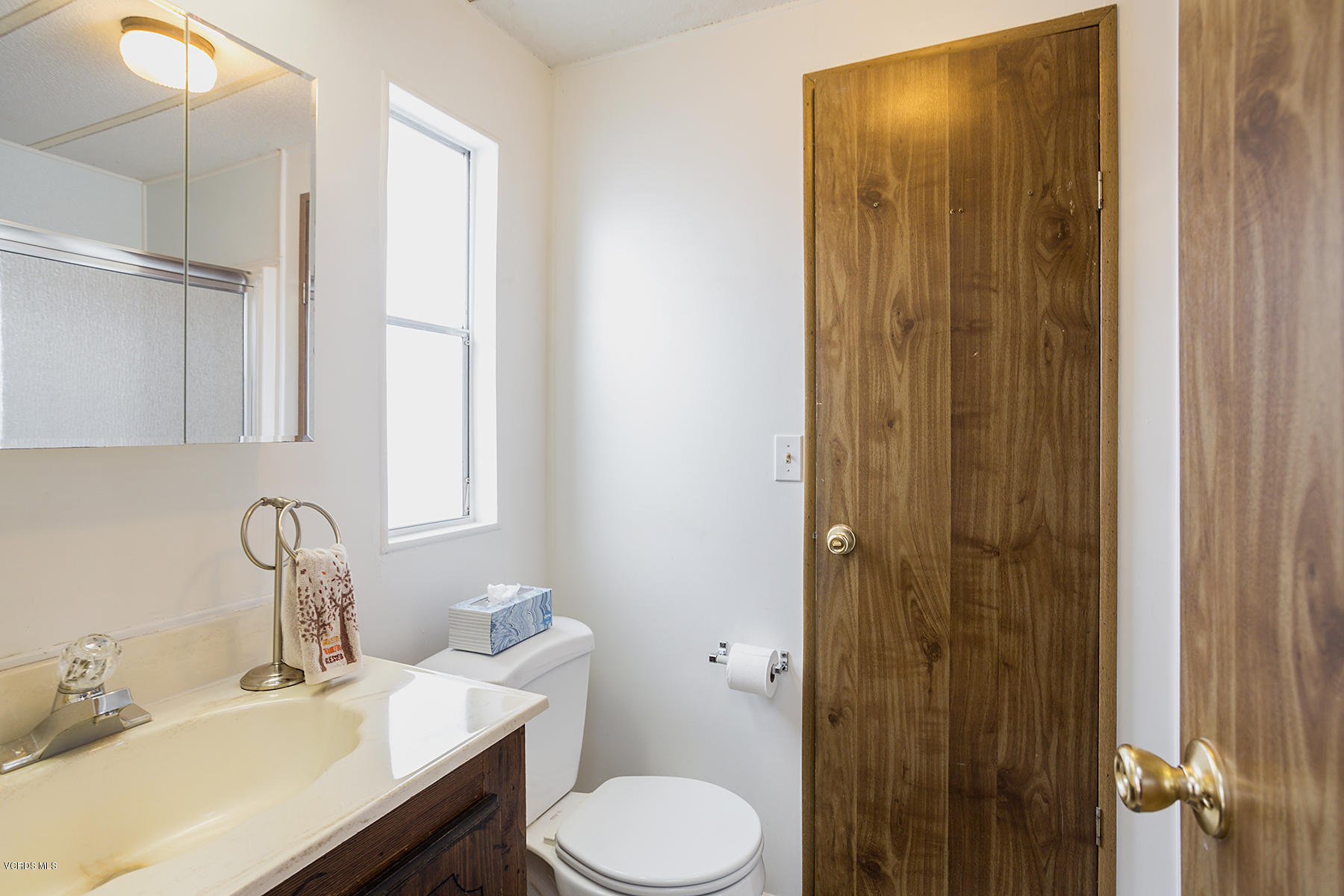 6480 Katherine Road, Unit 3 Simi Valley, CA 93063 - Photo 20 of 28 a bathroom with a sink and a mirror