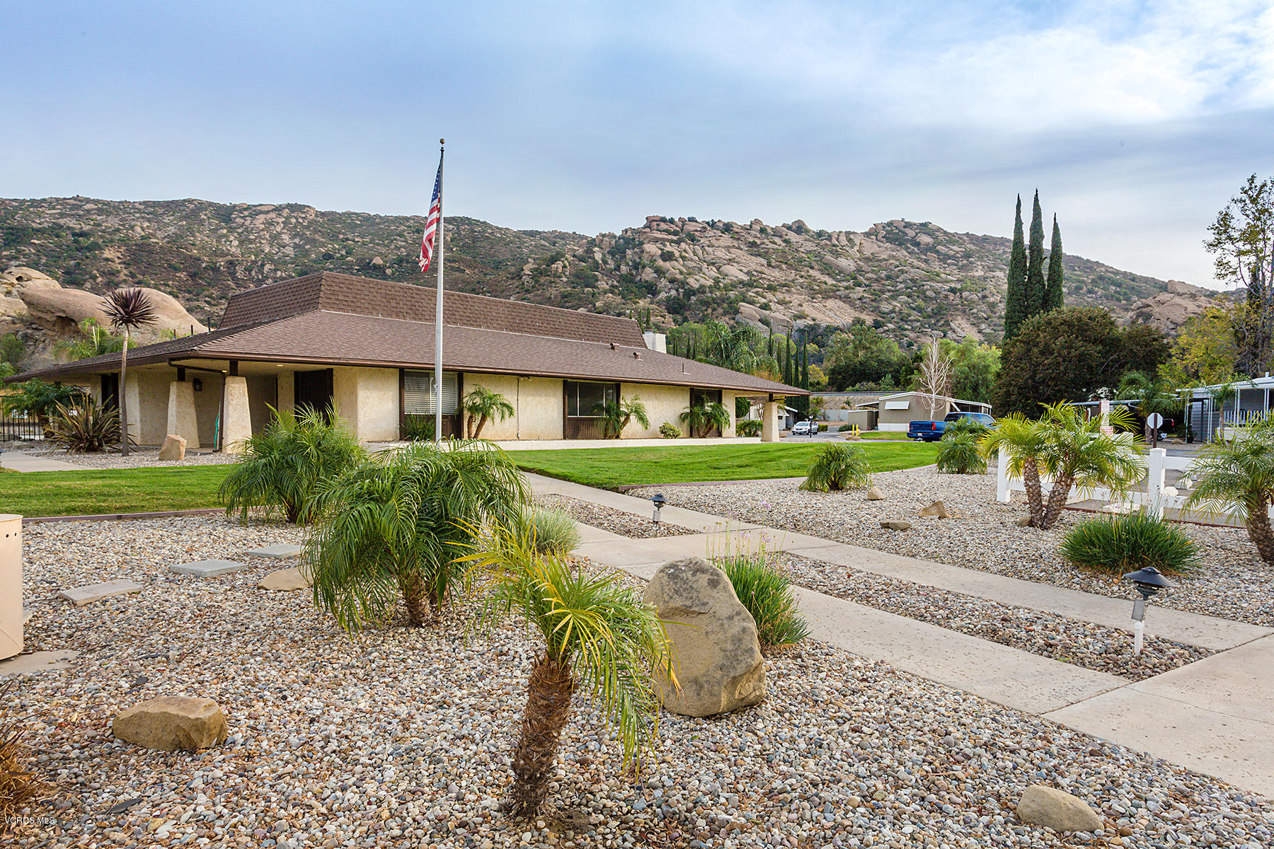 6480 Katherine Road, Unit 3 Simi Valley, CA 93063 - Photo 23 of 28 a front view of a house with a yard
