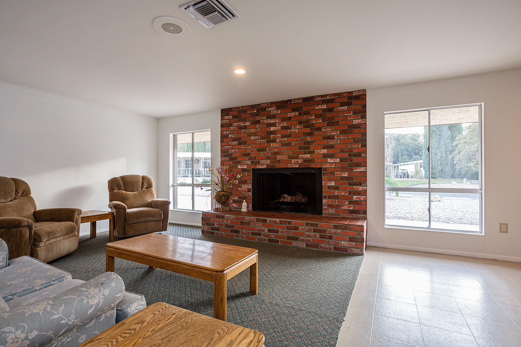 6480 Katherine Road, Unit 3 Simi Valley, CA 93063 - Photo 26 of 28 a living room with furniture and a fireplace