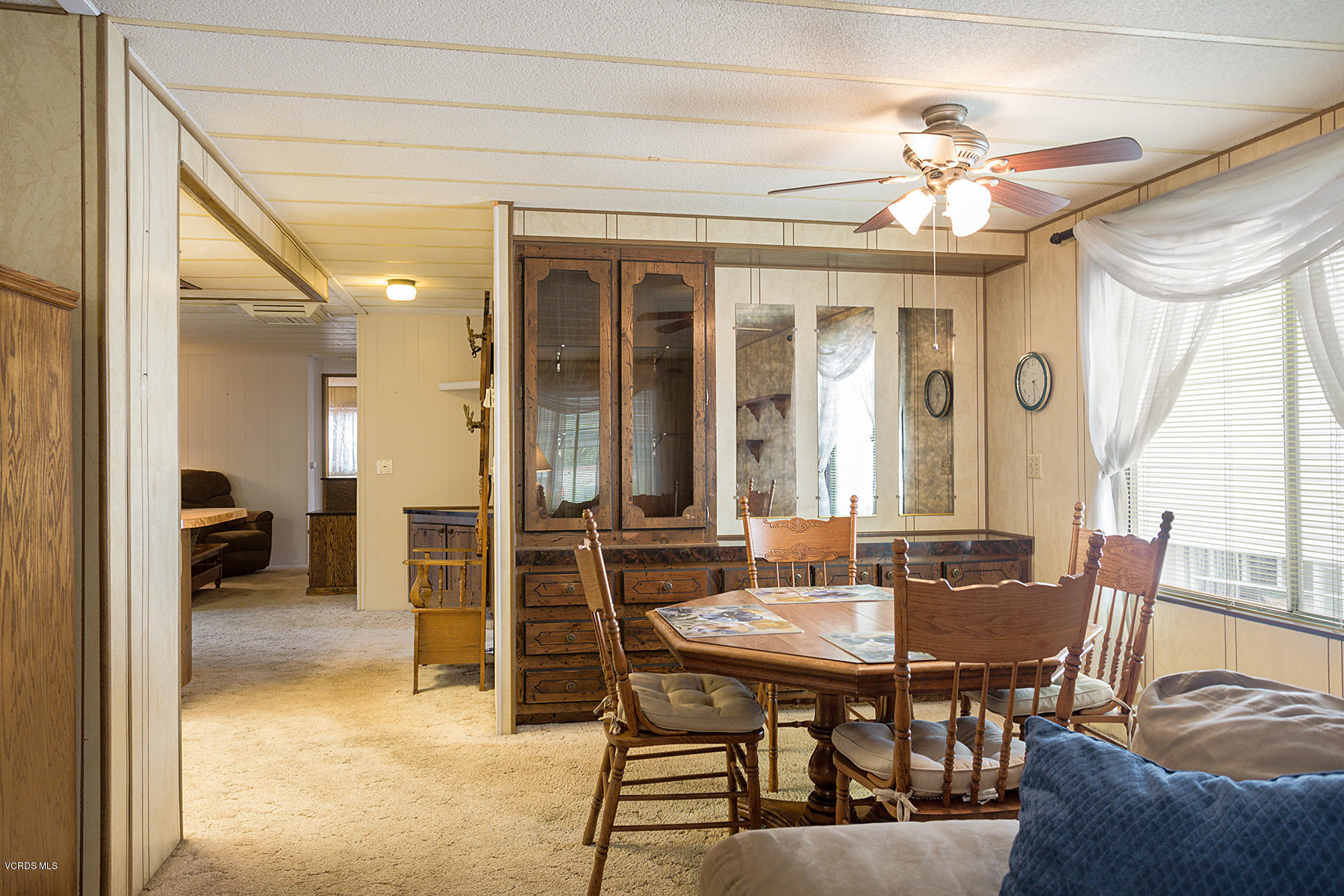 6480 Katherine Road, Unit 3 Simi Valley, CA 93063 - Photo 9 of 28 a view of a dining room with furniture and a chandelier