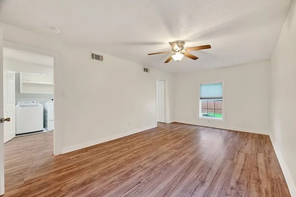 a bedroom with a bed and a chair