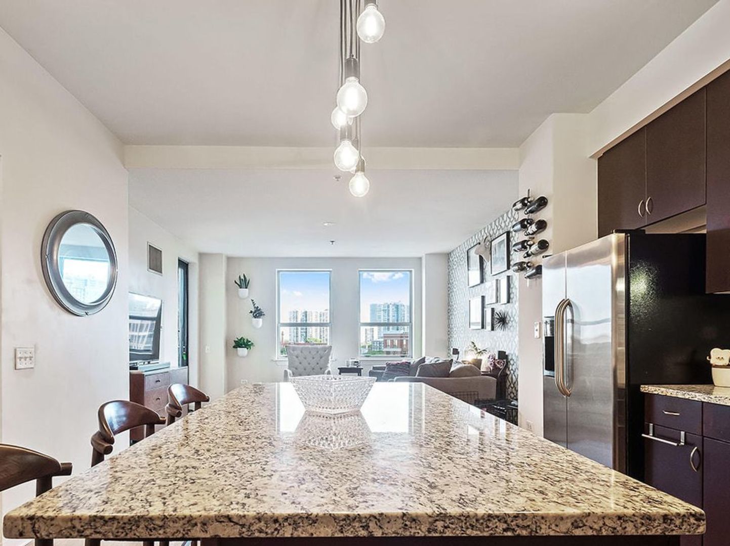 437 West Division Street, Unit 806 Chicago, IL 60610 - Photo 4 of 18 a kitchen with granite countertop a stove refrigerator and a sink