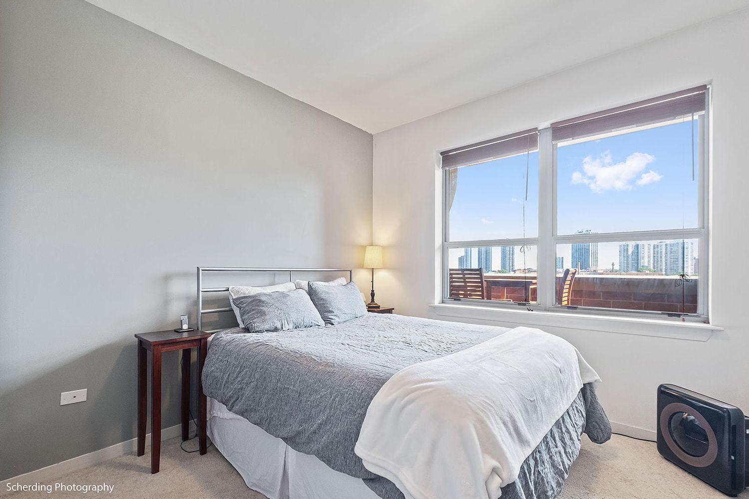 437 West Division Street, Unit 806 Chicago, IL 60610 - Photo 9 of 18 a bedroom with a bed and a large window