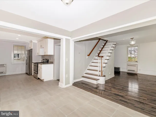 a view of kitchen with furniture and wooden floor