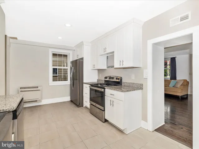 a view of a kitchen with electric appliances